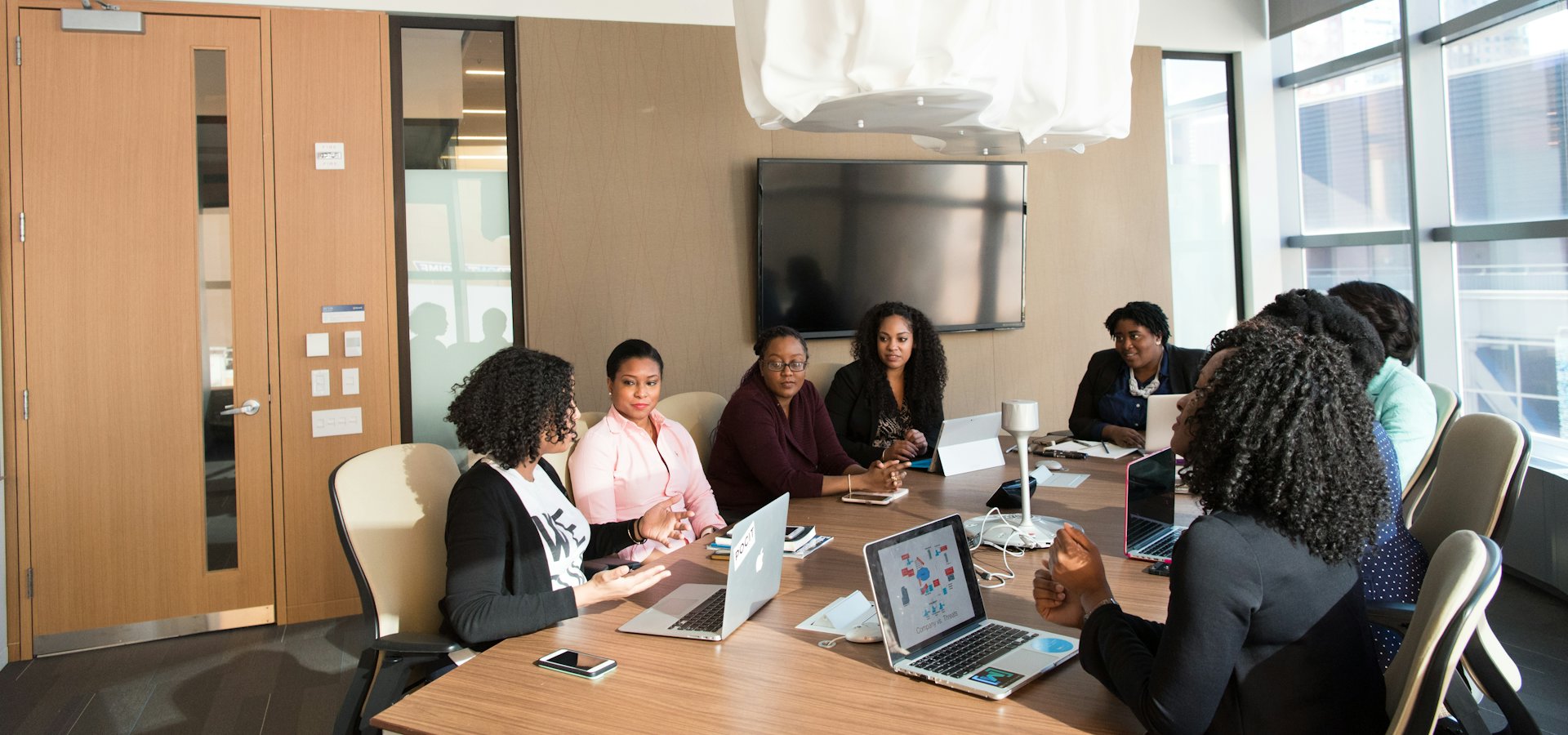 A team of professionals meeting around a conference table