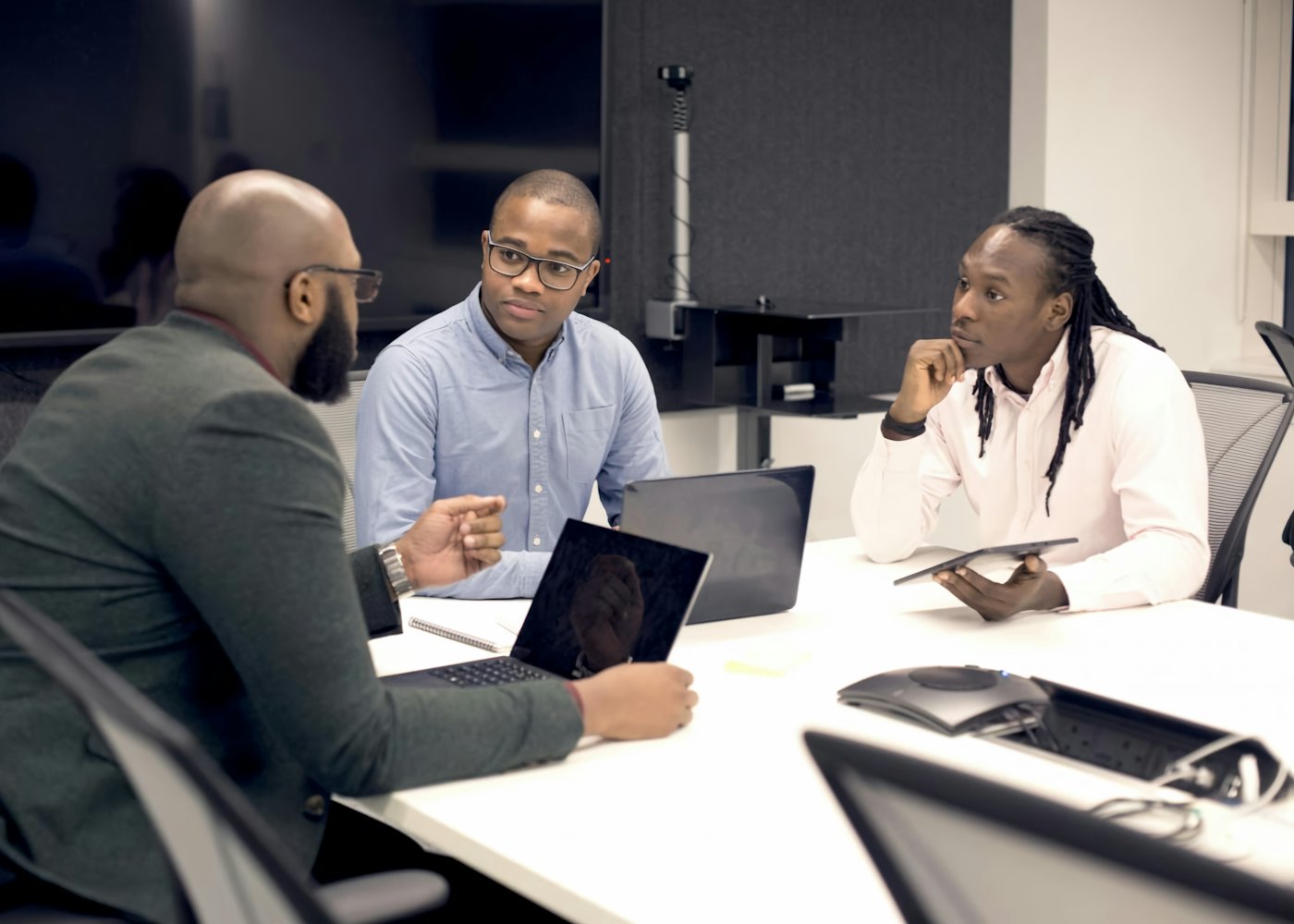 Business leaders in a focused strategy meeting